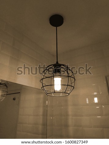 Bathroom decoration lamp in front of the mirror in a retro style, vintage lamp, sepia old style.