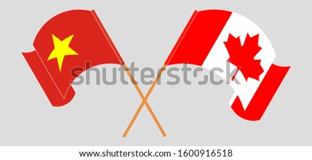 Crossed and waving flags of Canada and Vietnam. Vector illustration
