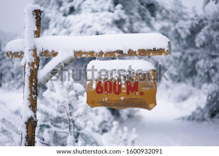 Signboard on the snowy scene