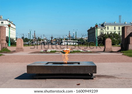View of a memorial of an eternal flame on the Field of Mars in Saint-Petersburg in spring sunny day.