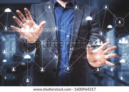 Businessman touches social network interface and glowing human resource concept