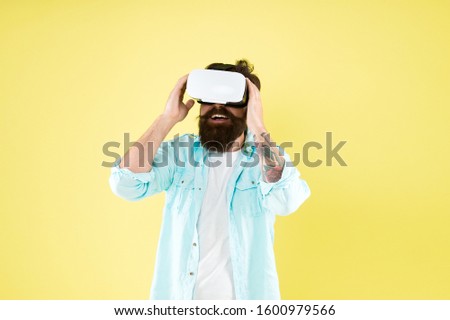 Testing software. Bearded man yellow background vr glasses. Large selection of compatible apps. Vr concept. Buy vr device. Eye tracking. Digital future and innovation. Developing technologies.