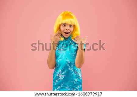 Anime admirer. Girl yellow wig. Cosplay character concept. Japanese style. Eastern trends for teens. Hobby and entertainment. Pop culture. Anime fan. Child cute cosplayer. Anime emotional expression.