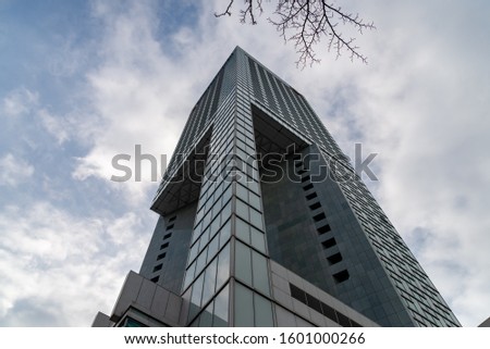 Glass skyscrapers of irregular shape. Bottom view. Abstract architectural detail of corporate building suitable as background