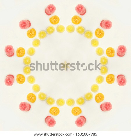 delicious fruit candies isolated in color background 