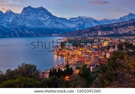 Christmas lights adorning the city center and Riva del Garda Street, View of the beautiful Riva del Garda town by night,Italy
