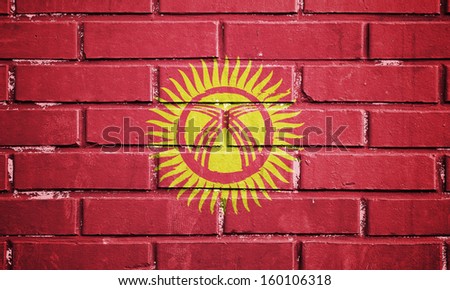 Kyrgyzstan flag on texture brick wall