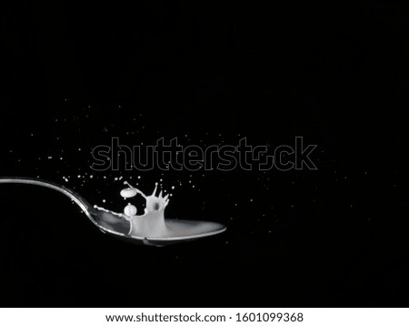 Splashing milk close up, black and white