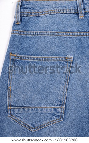 Close-up of a blue jeans back pocket


