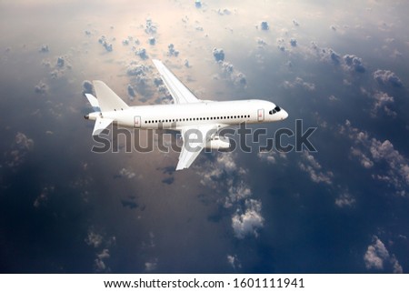 Passenger plane in flight. Aircraft makes a transatlantic flight over the ocean. Top view of the plane. Royalty-Free Stock Photo #1601111941