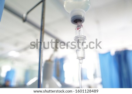 Intravenous infusion of normal saline in the hospital ward  Royalty-Free Stock Photo #1601128489