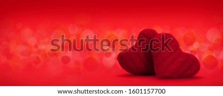 Valentines day heart decor over red background with bokeh and copy space for your greetings