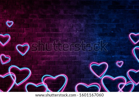 Brick wall, background, neon light.Neon Light Symbol Heart . Collection Valentine neon signs.Celebration Concept. symbols of love for Happy Women's, Mother's, Valentine's Day, birthday greeting card d