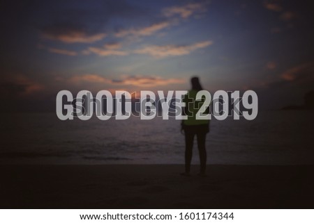 concept blur image a silhouette sunset at the beach and word - GOOD BYE 2019 