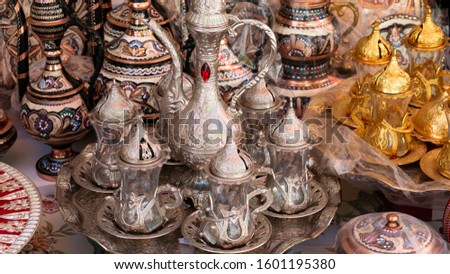 Turkish delight cups, pots, tea kettles and souvenirs are made of copper. Mostar city in Bosnia and Herzegovina. Local traditional handicraft tea and coffee pots and cups (Turkish style).