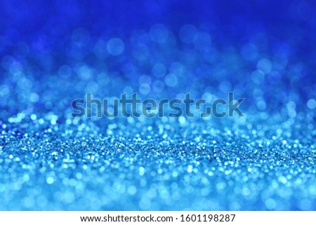 blue glitter shiny background.panton 2020 classic blue.glitter blue gradient texture with bokeh. classic blue swatch for print, web design.New year wallpapers phone