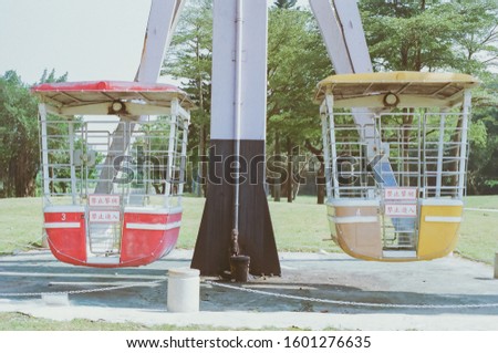 Two seats of the ferriswheel in the abandon amusement park , The Chinese letters means "No Entry."by Su Hsun
