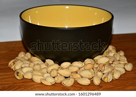Plate with pistachios and cleanings