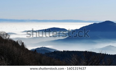 Mountain ranges in winter fog