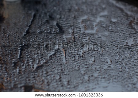 gray water drops on glass 