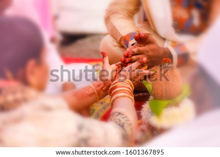 Traditional indian wedding ceremony:  coconut in decorative coper kalash 