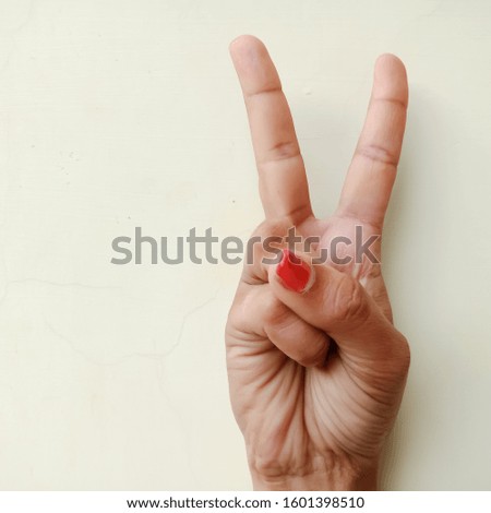 American sign language number two presented with hand isolated on white background
