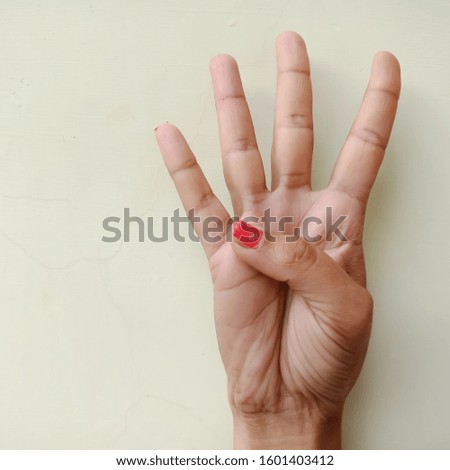 American sign language number four presented with hand isolated on white background