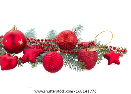 fir tree branch and red  christmas decorations isolated  on white background