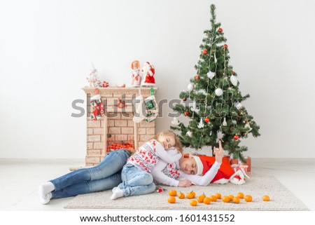 Holidays concept - happy family father and child at christmas tree at home