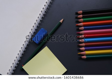 
black background and office supplies