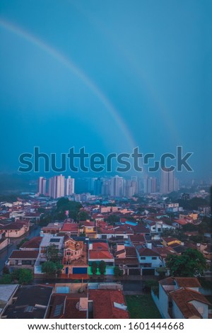 Double rainbow at Ribeirao Preto city skyline concept image.