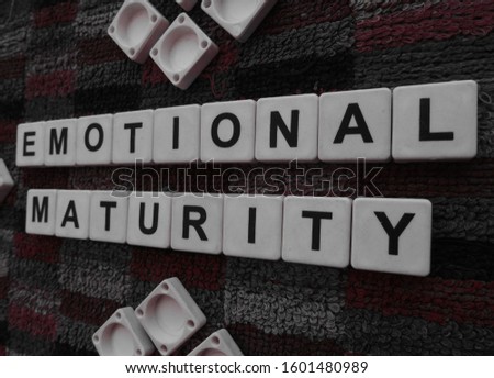 Emotional Maturity, word cube with background.