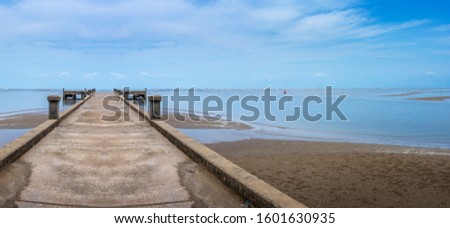 Panorama of the fish bridge protruding into the sea, leave blank space to put text.