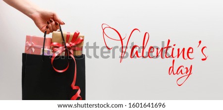 Small gift with red bow on white background.