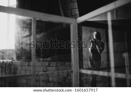 Art blur photo. Art concept. Portrait of charming girl in window. Double exposure