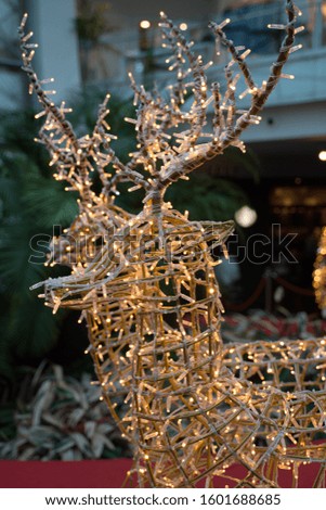 Reindeer Lightnings in Christmas Market reflecting festive season 