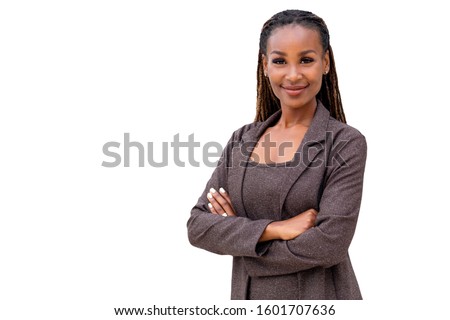 Beautiful female african american business woman CEO in a suit, isolated on white background, standing confidently with arms folded Royalty-Free Stock Photo #1601707636