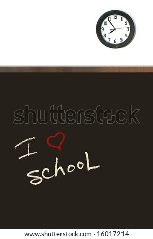 Black chalkboard with clock on white wall