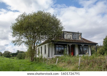 Old and abandoned French style Chateau in the middle of an Irish field West Cork Ireland