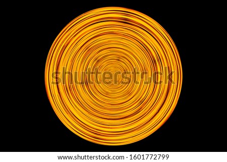 Abstract neon circle lines isolated on black background. Round cricle shape colorful led lights long exposure rotation photo.