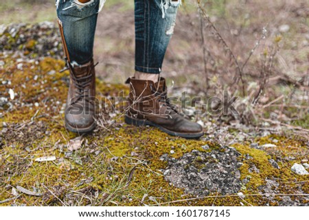 Guy hiking in comfortable hiking boots. Boots close-up stock photo.