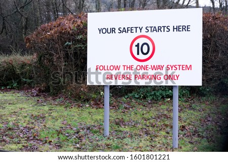 Reverse parking one way system in staff car park sign