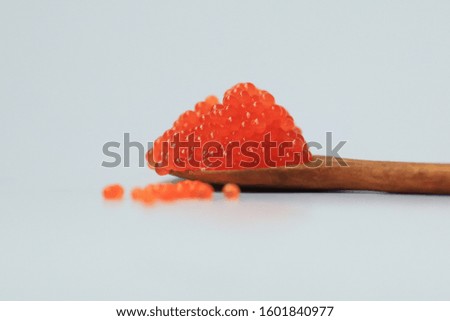 closeup red salted caviar on white background. Healthy food. Delicacy