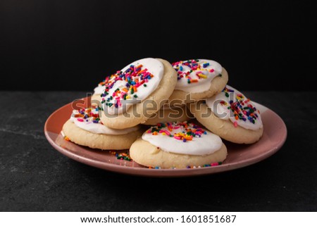 Sprinkle cookies with vanilla icing Royalty-Free Stock Photo #1601851687