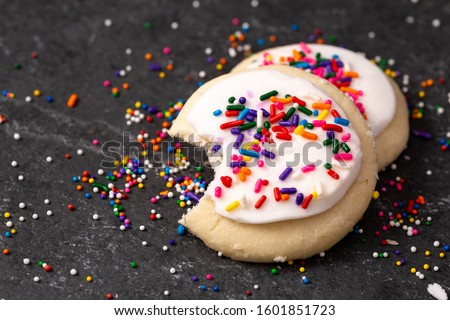 Sprinkle cookies with vanilla icing Royalty-Free Stock Photo #1601851723