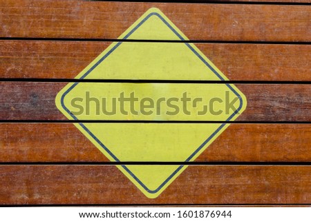 Blank yellow triangular caution sign, ready to fill with text.