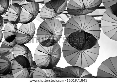 Abstract monochrome design with umbrellas for textured background.