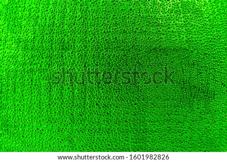 Green abstract background. Abstract drops on a green textured background. Blank for design and project.