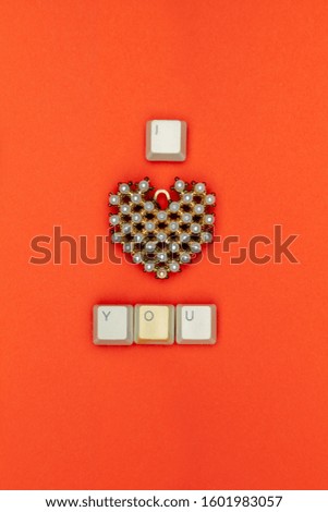 I love you phrase made out of keyboard buttons, horizontally oriented.