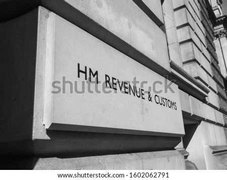 HMRC (Her Majesty Revenue and Customs) sign in London, UK in black and white Royalty-Free Stock Photo #1602062791
